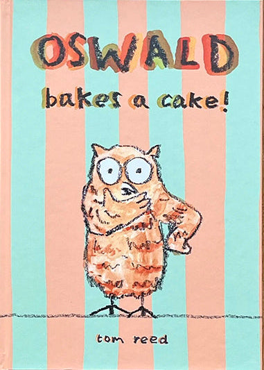 Book cover of 'Oswald Bakes a Cake!' by Tom Reed on a wooden surface